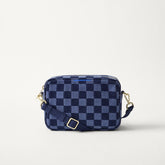 EXT | The Crossbody Camera Bag in ReVelvet™ Blue Ink, shown from the front.