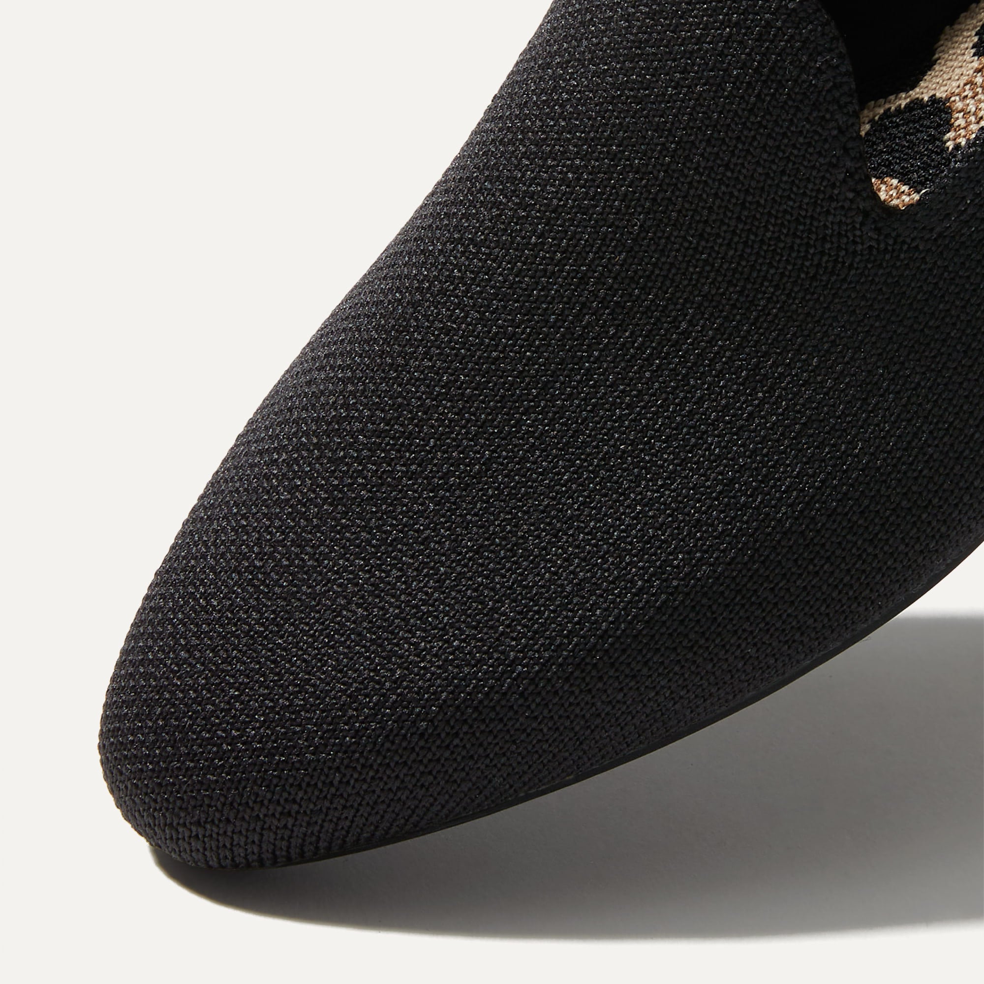 Close up of the toe and vamp of The Almond Loafer in Black. 
