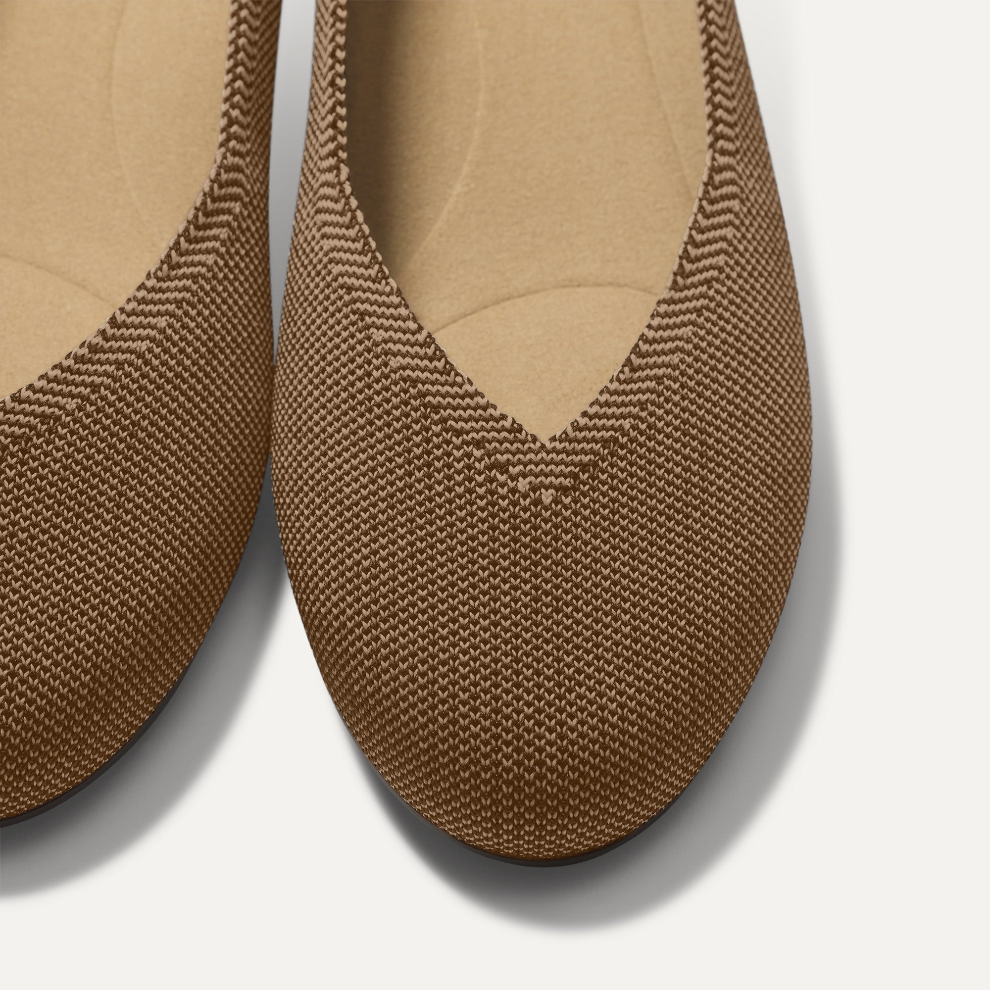 Close up of the toe and vamp of The Daily Flat in Minx. 
