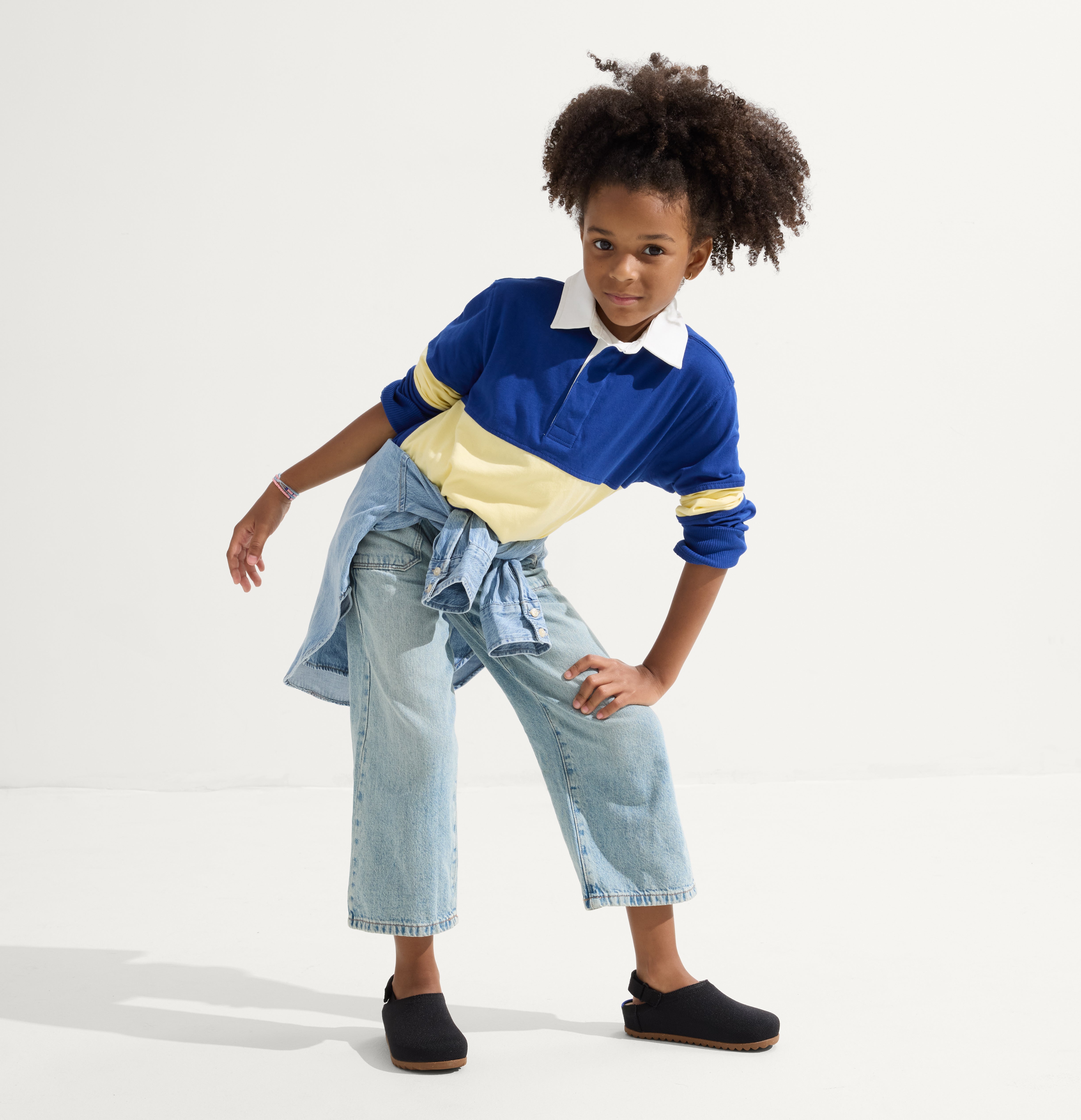 model | Alternate view of a girl wearing The Kids Clog in Black. 