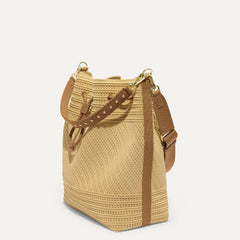 The Cinch Bucket Bag in Brown Butter Crochet shown from the side.